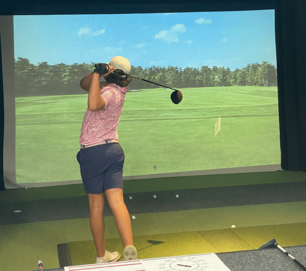 This player practices at a golf sim. Photo by Golfspan.com.